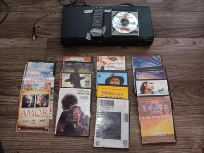 Samsung Dvd player and remote with a variety of dvd movies in different languages