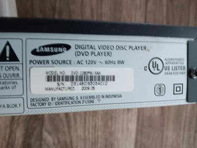 Samsung Dvd player and remote with a variety of dvd movies in different languages