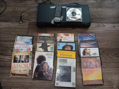 Samsung Dvd player and remote with a variety of dvd movies in different languages