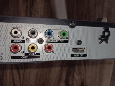 Samsung Dvd player and remote with a variety of dvd movies in different languages