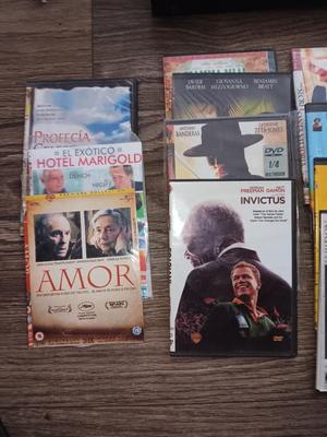 Samsung Dvd player and remote with a variety of dvd movies in different languages