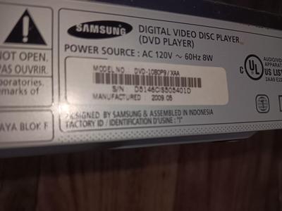 Samsung Dvd player and remote with a variety of dvd movies in different languages