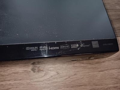 Samsung Dvd player and remote with a variety of dvd movies in different languages