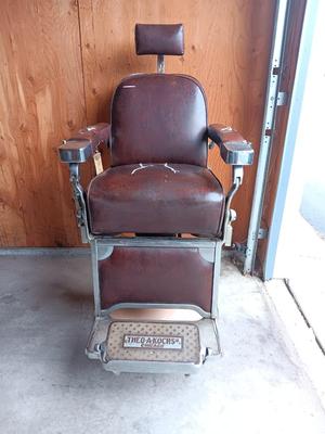 Antique barber chair with attached razor strap