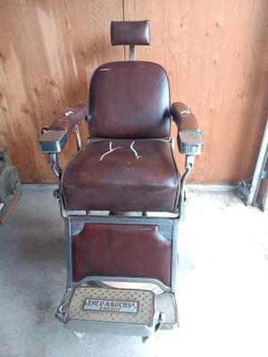 Antique barber chair with attached razor strap