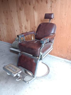 Antique barber chair with attached razor strap