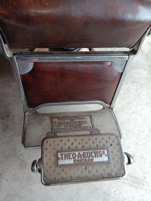 Antique barber chair with attached razor strap