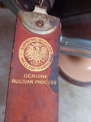 Antique barber chair with attached razor strap