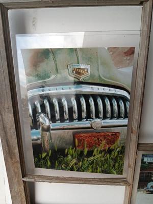Antique wooden window frame with photographs of a Buick Eight car