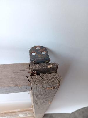 Antique wooden window frame with photographs of a Buick Eight car