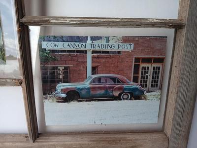 Antique wooden window frame with photographs of a Buick Eight car