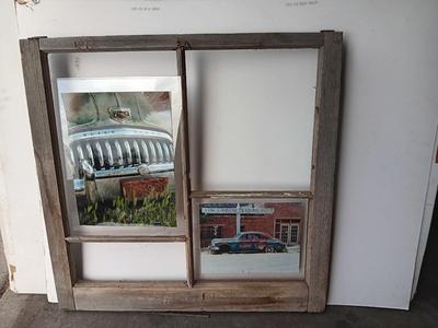 Antique wooden window frame with photographs of a Buick Eight car