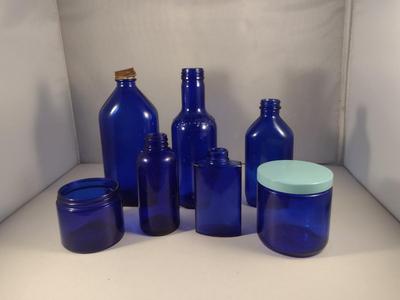 Collection of Cobalt Blue Glass Bottles and Jars