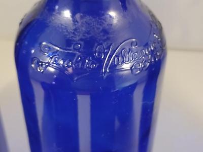 Collection of Cobalt Blue Glass Bottles and Jars