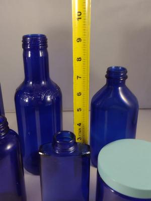 Collection of Cobalt Blue Glass Bottles and Jars