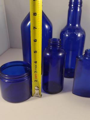 Collection of Cobalt Blue Glass Bottles and Jars