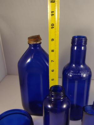 Collection of Cobalt Blue Glass Bottles and Jars