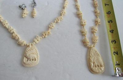 2 Carved Plastic Elephant Necklaces and One Earrings Set