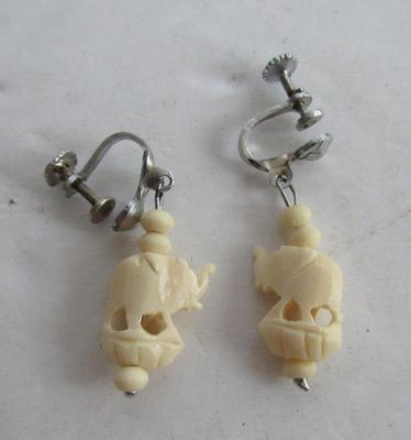2 Carved Plastic Elephant Necklaces and One Earrings Set