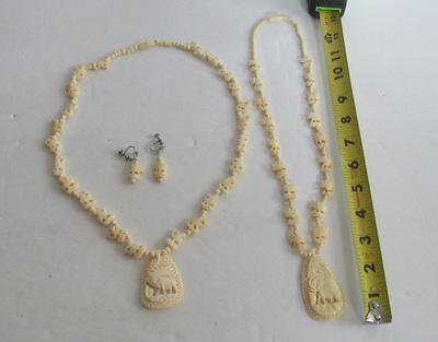 2 Carved Plastic Elephant Necklaces and One Earrings Set