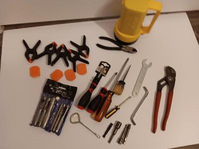 Variety of hand tools - Hollow punch set - Clamps - screwdrivers - pliers and more