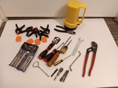 Variety of hand tools - Hollow punch set - Clamps - screwdrivers - pliers and more