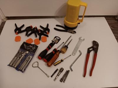 Variety of hand tools - Hollow punch set - Clamps - screwdrivers - pliers and more