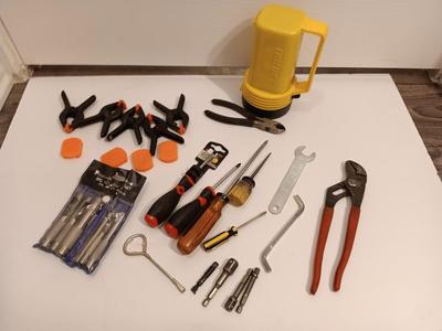 Variety of hand tools - Hollow punch set - Clamps - screwdrivers - pliers and more