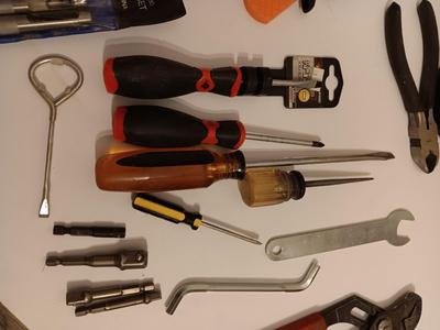 Variety of hand tools - Hollow punch set - Clamps - screwdrivers - pliers and more