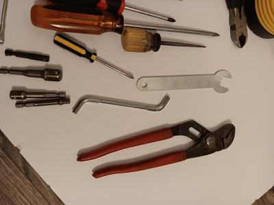 Variety of hand tools - Hollow punch set - Clamps - screwdrivers - pliers and more