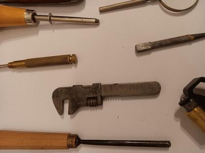 Assortment of older hand tools most with wooden handles