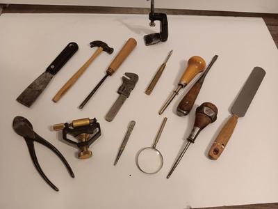 Assortment of older hand tools most with wooden handles
