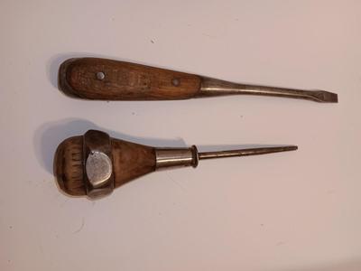 Assortment of older hand tools most with wooden handles