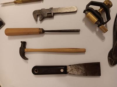 Assortment of older hand tools most with wooden handles