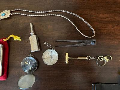 COMPASSES, BOLO TIE, BELT BUCKLE, HAND WARMER AND MORE