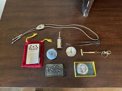 COMPASSES, BOLO TIE, BELT BUCKLE, HAND WARMER AND MORE