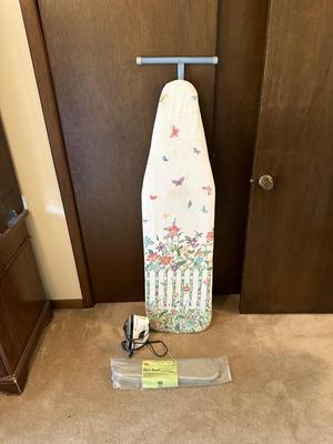 IRONING AND SLEEVE BOARD PLUS A CLOTHES IRON