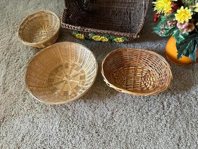 WICKER BASKETS AND FAUX FLOWERS IN A VASE