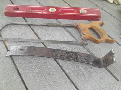 Antique wooden Peerless level with hand saw claw bar and leather gloves