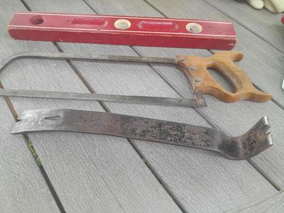 Antique wooden Peerless level with hand saw claw bar and leather gloves