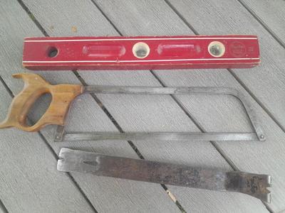 Antique wooden Peerless level with hand saw claw bar and leather gloves