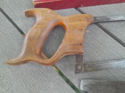 Antique wooden Peerless level with hand saw claw bar and leather gloves