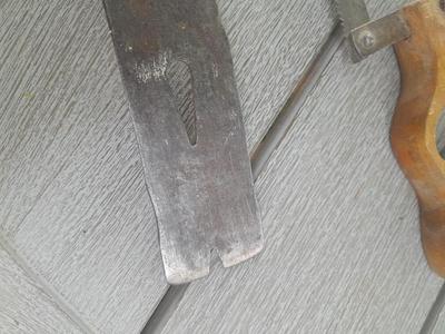 Antique wooden Peerless level with hand saw claw bar and leather gloves