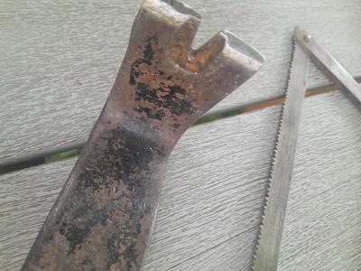 Antique wooden Peerless level with hand saw claw bar and leather gloves