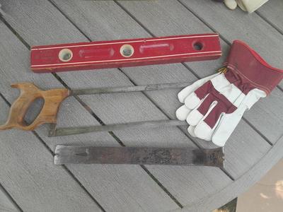 Antique wooden Peerless level with hand saw claw bar and leather gloves