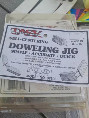 Task self-centering Doweling Jig Assortment of woodworking items and supplies