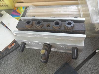 Task self-centering Doweling Jig Assortment of woodworking items and supplies