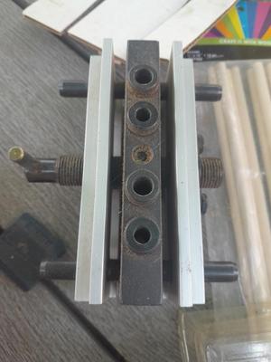 Task self-centering Doweling Jig Assortment of woodworking items and supplies