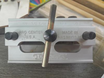 Task self-centering Doweling Jig Assortment of woodworking items and supplies