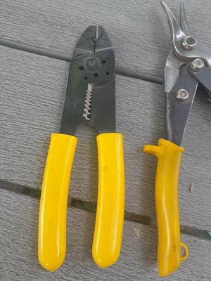 Assortment of yellow handled tools - wire strippers - tin snips= and drivers with bits